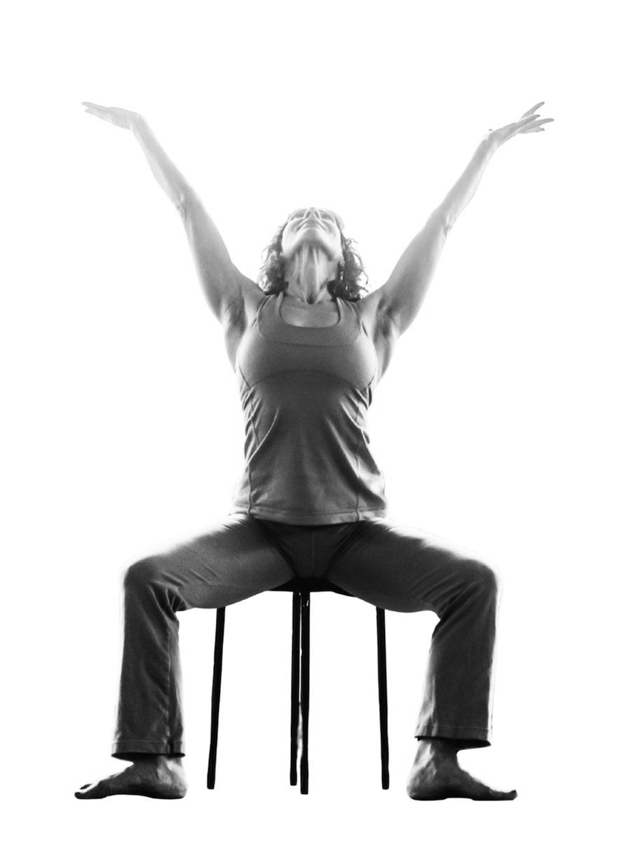 Dina Cohen offering a versatile accessible chair yoga sequence in her chair yoga course