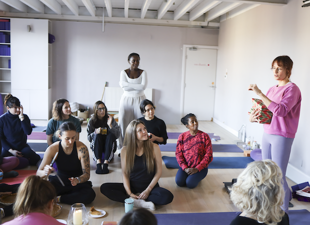 Charli Van Ness lecturing to a group of students at the Shala School