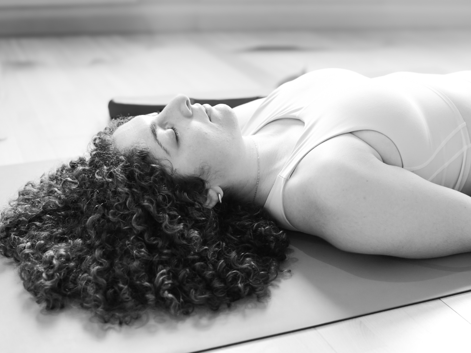Student in deep yoga nidra relaxation on Elemental Yoga Nidra course with Emma Landolt