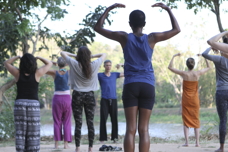 Gingi Lee teaching yoga by the lake at Ulpotha Retreat in Sri Lanka