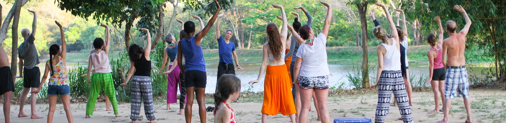 Practicing yoga by the lake at Ulpotha retreat centre, Sri Lanka with Gingi Lee