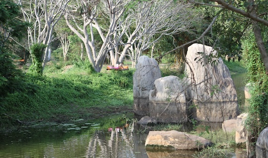 Relaxing by the lake at Ulpotha Retreat Centre in Sri Lanka