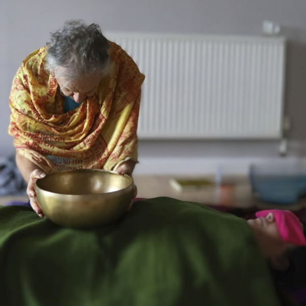 Student Robert W working with sound vibration on a 300-hour teacher training