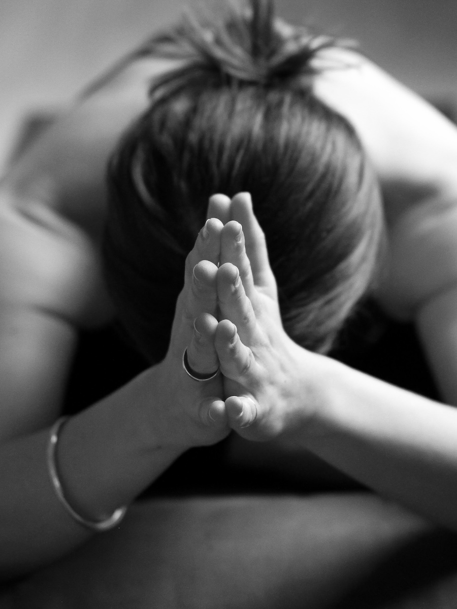 Student in a prayers pose at Norman's yin yoga course