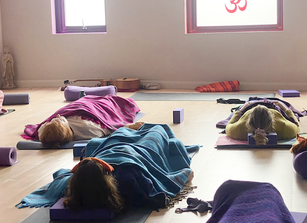 Students in a Yoga Nidra meditation on a training at the Shala