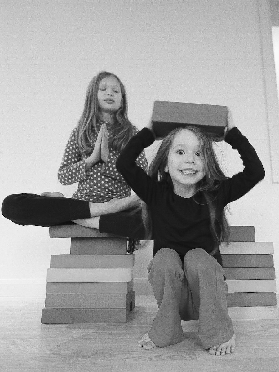 Kids doing yoga on a kids yoga teacher training course in London, UK
